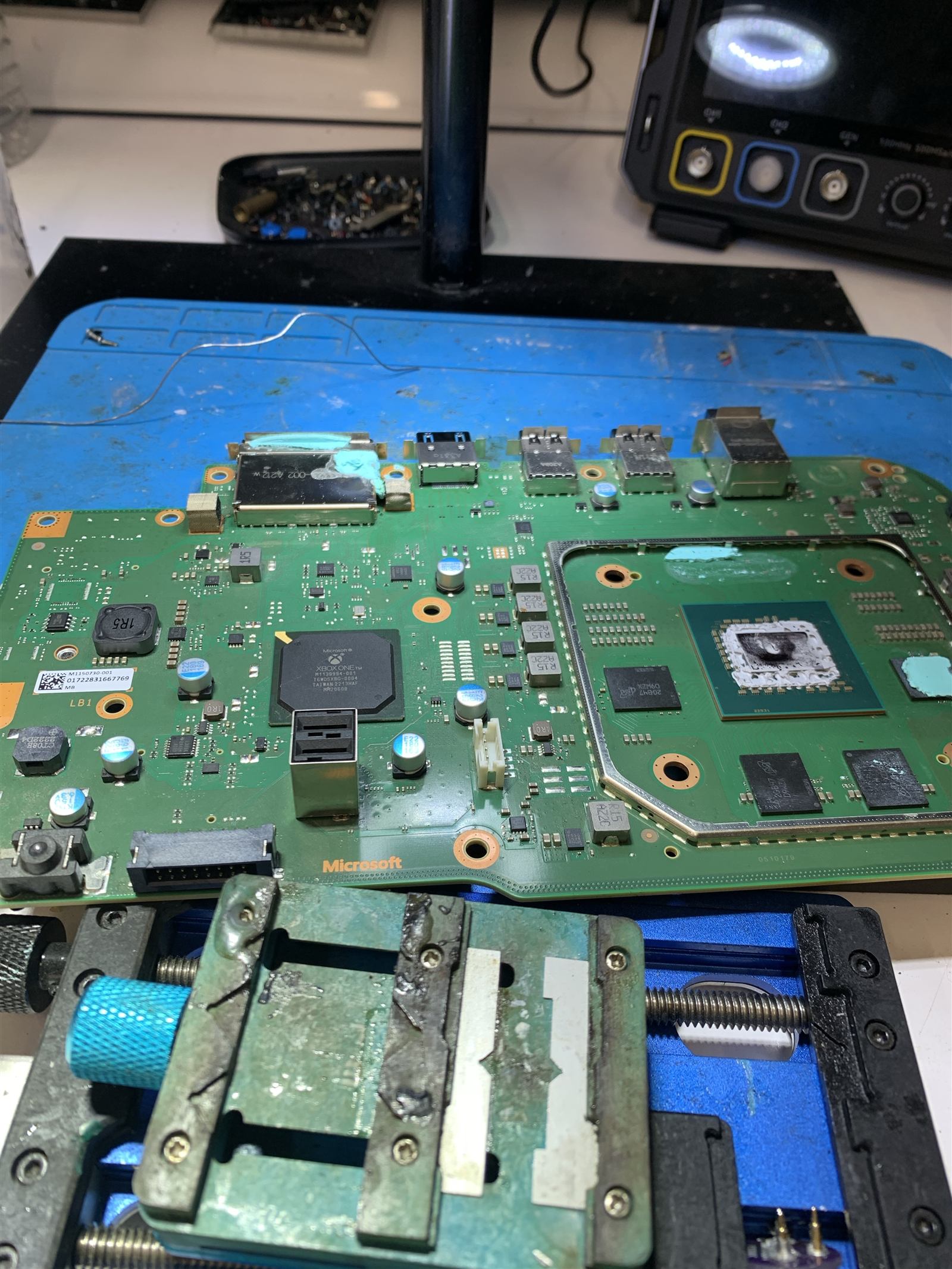 Xbox One motherboard on the bench during HDMI port diagnosis in Brisbane